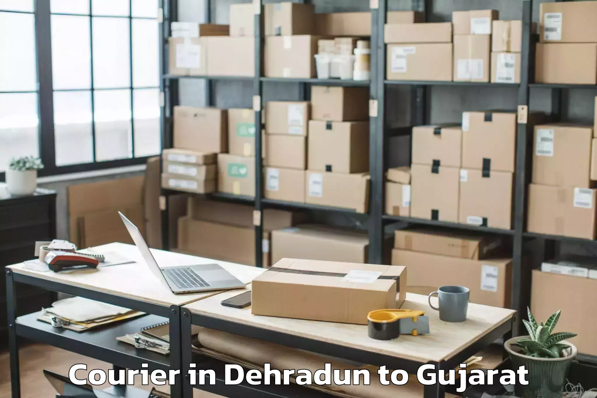 Efficient Dehradun to Halvad Courier